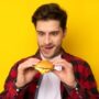 Hungry man eyeing hamburger