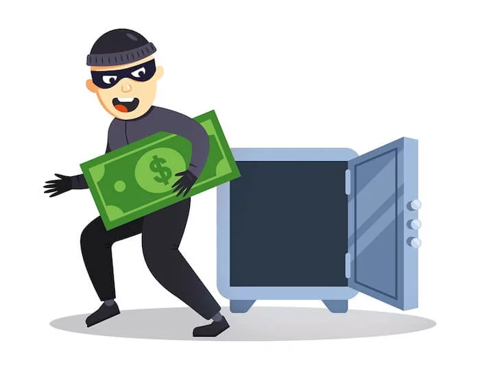 Masked burglar steals money from a safe