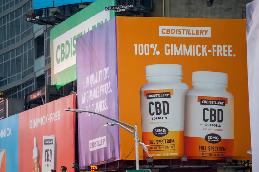 A CBDistillery billboard advertising "gimmick-free" CBD products in New York city.