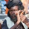 Sadhu man smoking marijuana in India